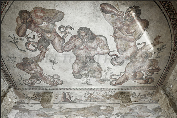 The triclinium room where dinners with dances and music were organized. The mosaics represent Hercules and some Gods The triclinium room where dinners with dances and music were organized. The mosaics represent Hercules and some Gods