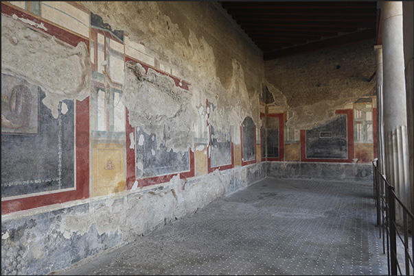 The columned patio in the center of the villa with well-preserved frescoes of Roman life and culture on the walls