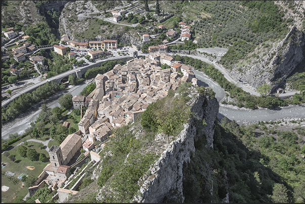 The walled village of Entrevaux perched on a rocky cliff bordered by the Var River