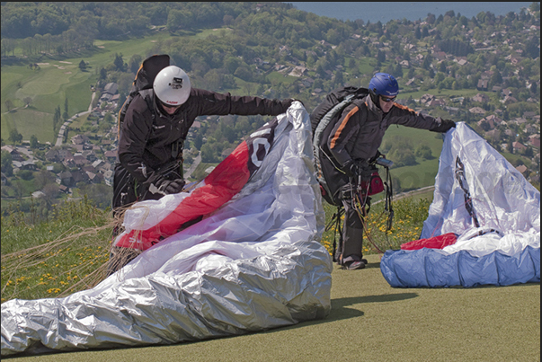 Starting for paragliding in the country of Blufy located under the mountain called The Dents de Lanfon near Talloires Starting for paragliding in the country of Blufy located under the mountain called The Dents de Lanfon near Talloires