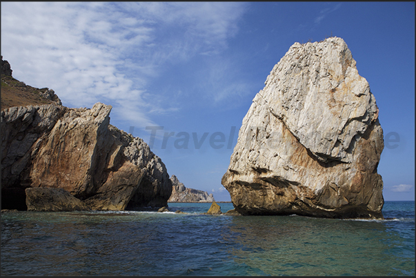 Rock in front of the rugged coast between Capo Pecora and the village of Buggerru Rock in front of the rugged coast between Capo Pecora and the village of Buggerru
