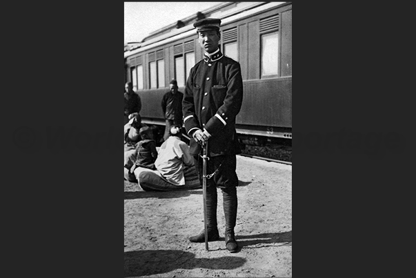 Rail station of Pukow. A small town on the railway line Canton - Beijing. A Chinese policeman Rail station of Pukow. A small town on the railway line Canton - Beijing. A Chinese policeman