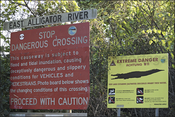Crocodile warning signs on the road that crosses the Kakadu National Park Crocodile warning signs on the road that crosses the Kakadu National Park