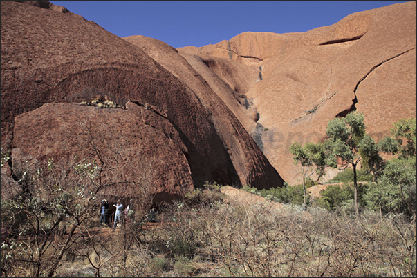 At the base of monolithe, there are caves used by Aborigines in different ways such as kitchen or to celebrate sacred rites At the base of monolithe, there are caves used by Aborigines in different ways such as kitchen or to celebrate sacred rites