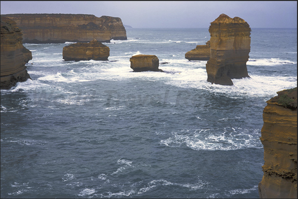 Great Ocean Road. During the day, the cliffs change color from yellow, in the morning, to the red in the evening Great Ocean Road. During the day, the cliffs change color from yellow, in the morning, to the red in the evening