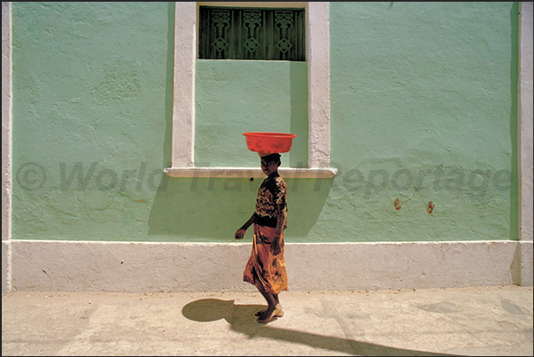In the streets of the town, is a constant coming and going from the market In the streets of the town, is a constant coming and going from the market